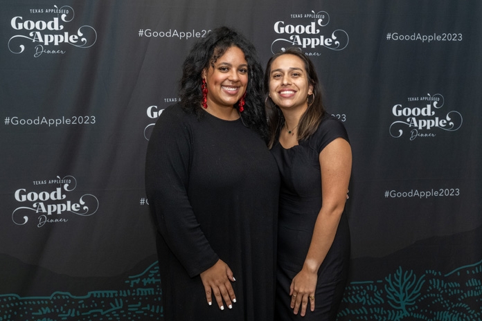Two guests attend the 2023 Good Apple Dinner.