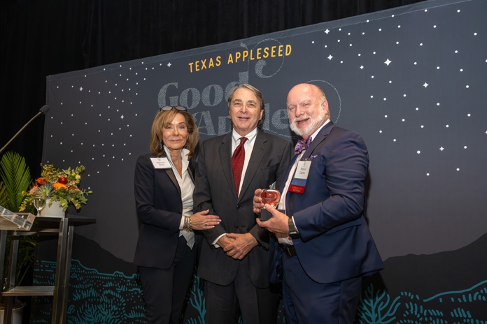 Patrick Cantilo presents the Good Apple Award to Melanie Gray and Mark Wawro