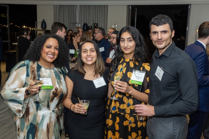 People smiling at the Good Apple Dinner