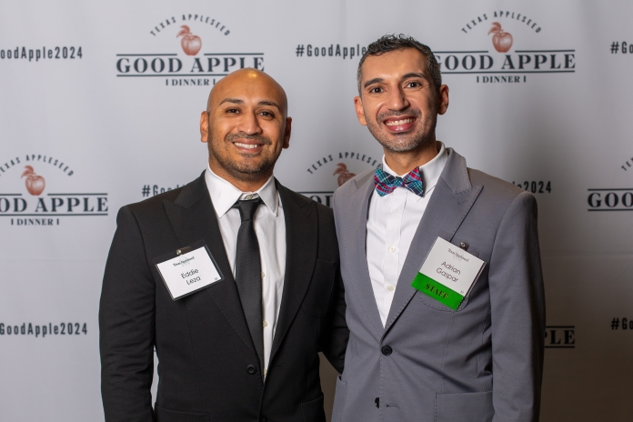 People smiling at the Good Apple Dinner