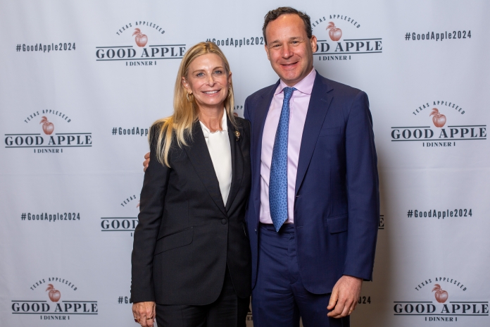 People smiling at the Good Apple Dinner