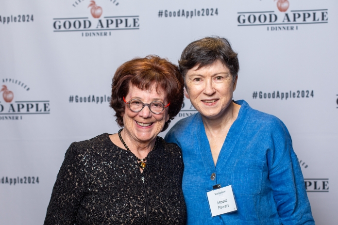 People smiling at the Good Apple Dinner