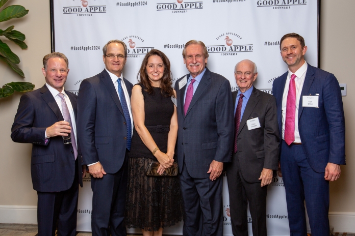 People smiling at the Good Apple Dinner