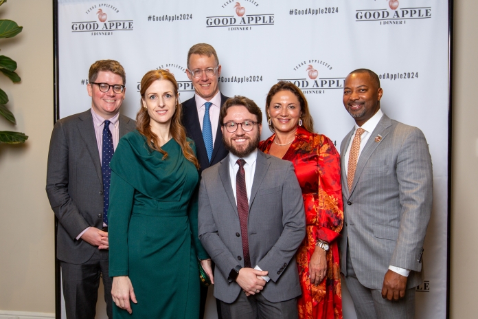 People smiling at the Good Apple Dinner