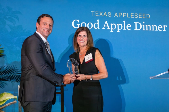 A representative from Alston and Bird receiving the Pro Bono Award